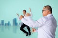 Asian business man punching business man sitting chair Express feeling In room cityÃÂ blurry background Metaphor for Success financ Royalty Free Stock Photo